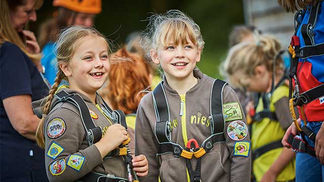 Two girls in Brownie uniforms, having fun at PGL